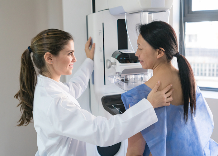 A woman having a mammogram